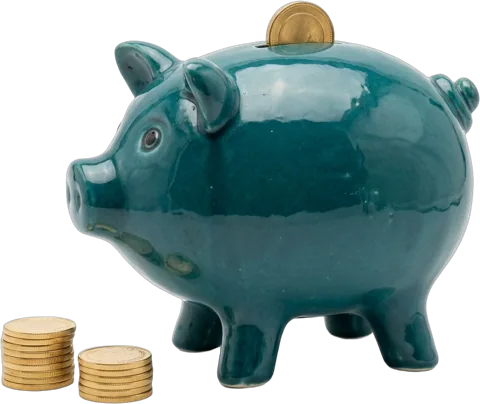 A teal ceramic piggy bank with a coin going into the slot and two stacks of gold coins beside it