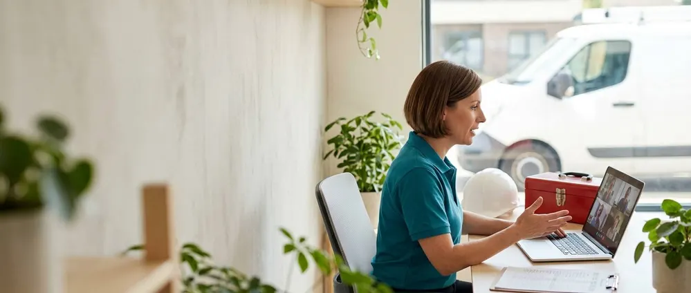 A home services business owner on a video call, describing the role
