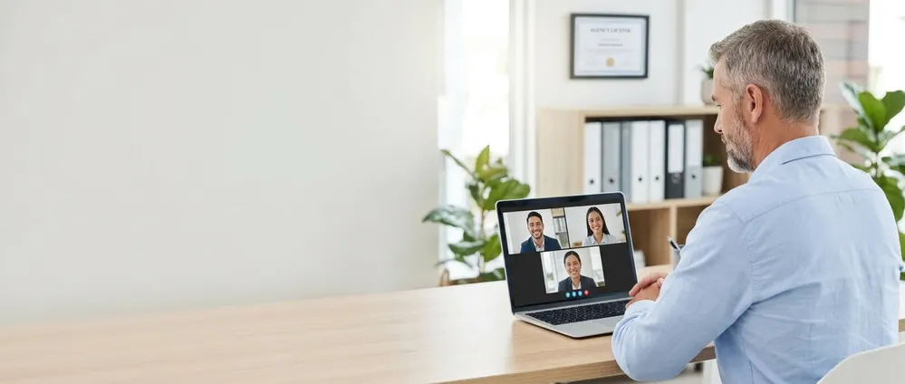 The same insurance agency owner interviewing three candidates on a video call