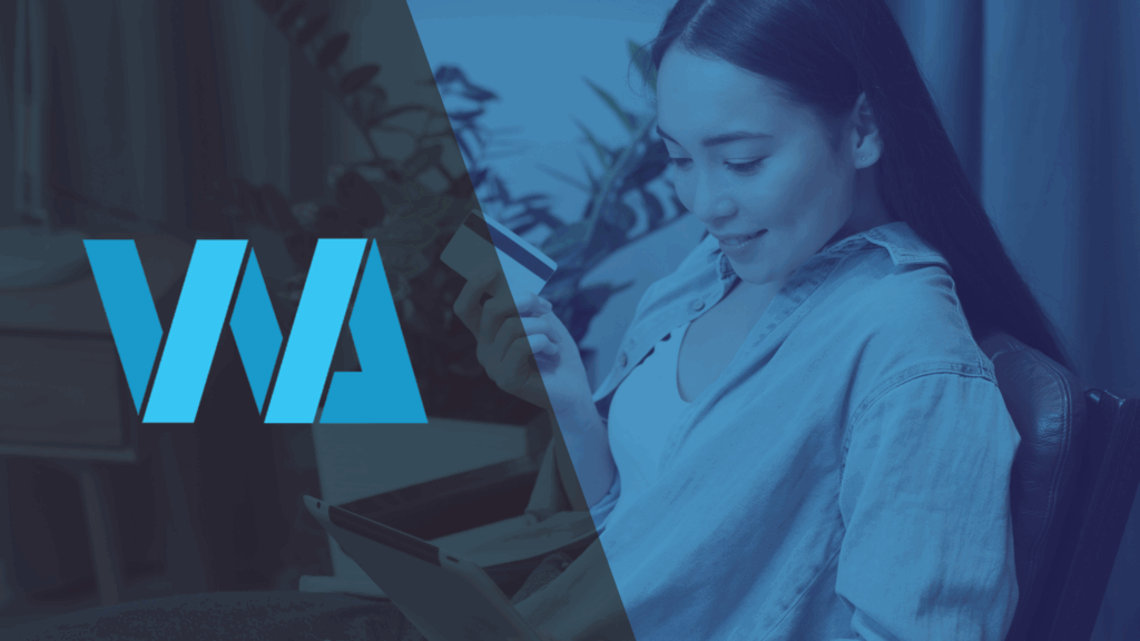 Smiling woman making an online payment with a credit card and tablet, representing faster payment collection through outsourcing accounts receivable.